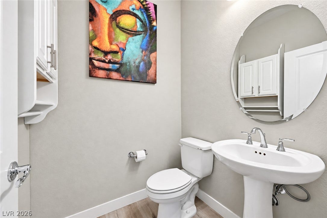 31 Cresta Villa Court, Henderson, NV 89011 Clean lines and classic fixtures define this comfortable powder room.