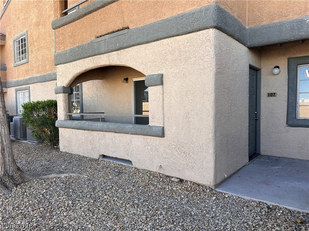 230 Mission Catalina Lane, #107, Las Vegas, NV 89107 A private covered patio and entryway define the exterior of this ground-level unit.