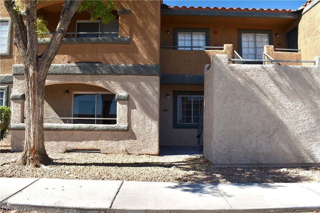 230 Mission Catalina Lane, #107, Las Vegas, NV 89107 Stucco exterior finishes and tiled roofing create a classic southwestern architectural style.