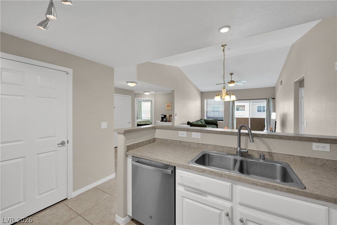 8777 W Maule Avenue, #2109, Las Vegas, NV 89148 An open floor plan connects the functional kitchen workspace with the main living area.