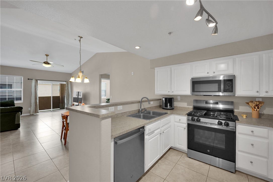 8777 W Maule Avenue, #2109, Las Vegas, NV 89148 An open floor plan flows effortlessly from the kitchen into the bright dining area.