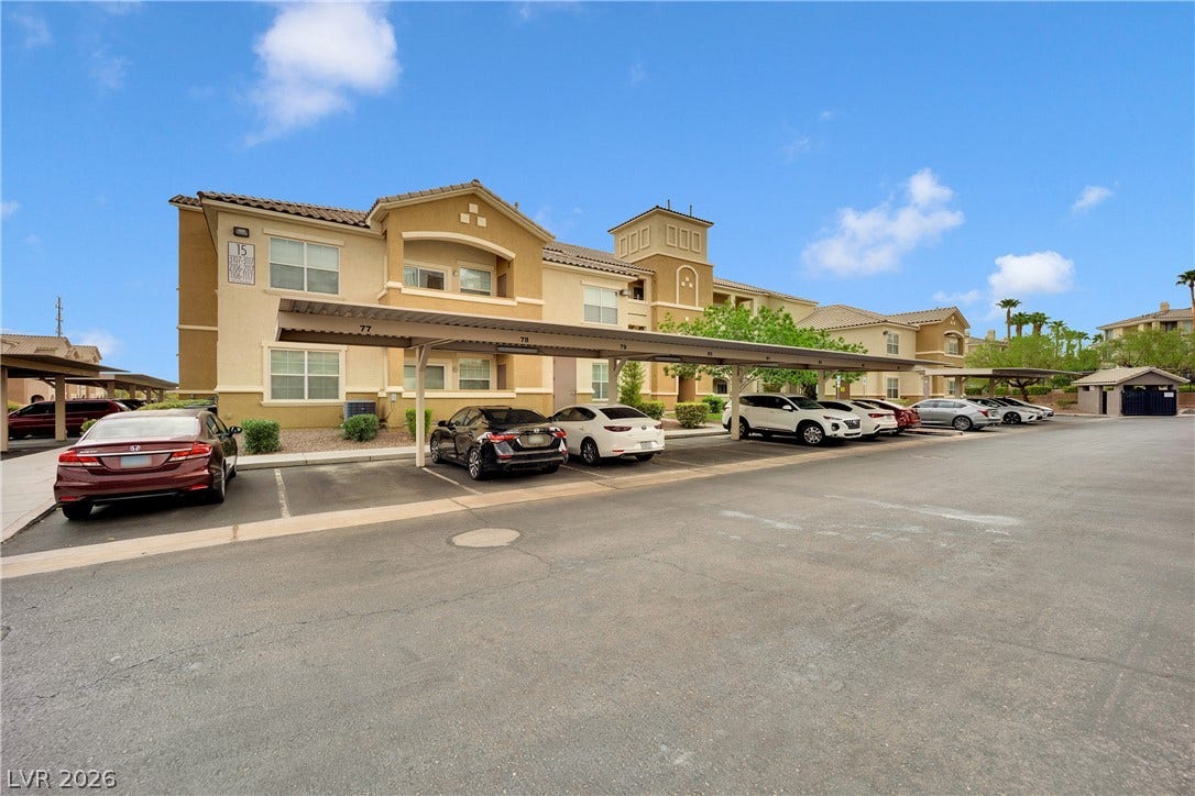 8777 W Maule Avenue, #2109, Las Vegas, NV 89148 Covered parking areas provide convenient shelter adjacent to the multi-level residential structures.