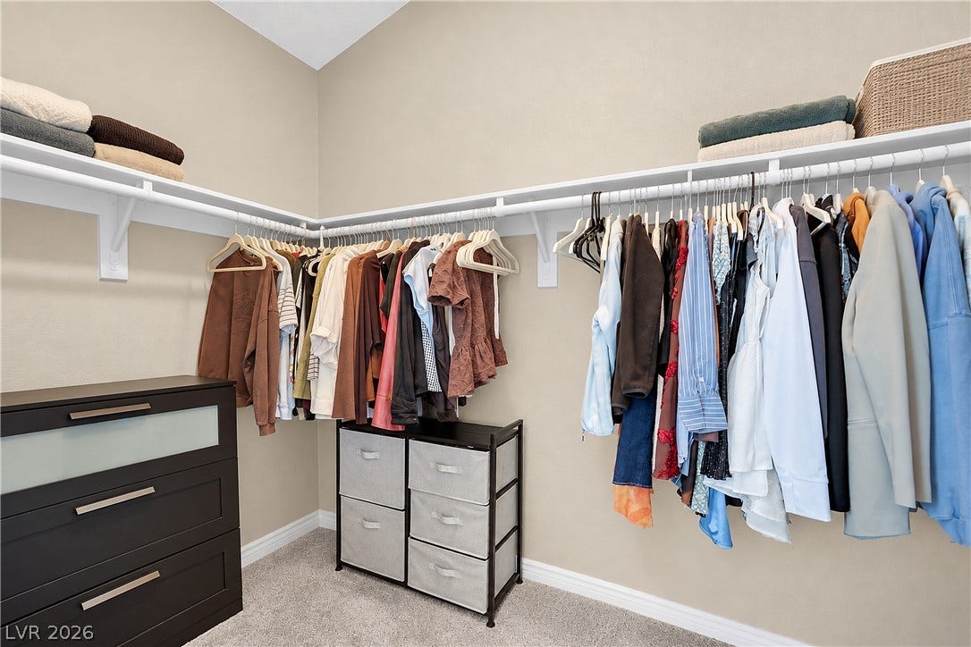 8777 W Maule Avenue, #2109, Las Vegas, NV 89148 A spacious walk-in closet includes carpet flooring and vaulted ceilings.