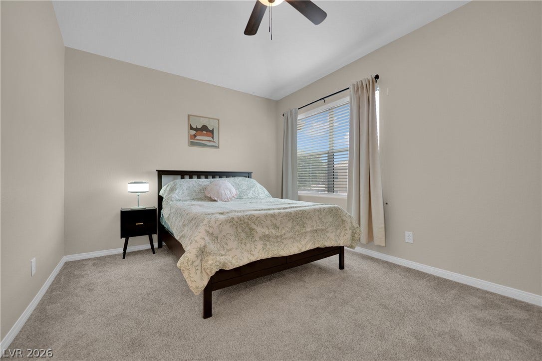 8777 W Maule Avenue, #2109, Las Vegas, NV 89148 Soft carpeting underfoot defines this comfortable bedroom anchored by a large window.