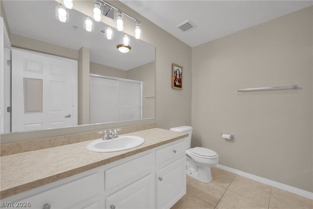 8777 W Maule Avenue, #2109, Las Vegas, NV 89148 A spacious vanity with integrated storage highlights this functional bathroom featuring tile flooring.