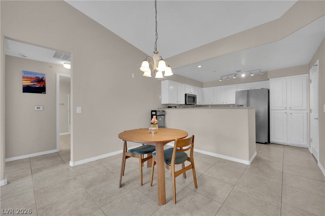 8777 W Maule Avenue, #2109, Las Vegas, NV 89148 Tiled flooring and high ceilings define this inviting dining area adjacent to the kitchen.