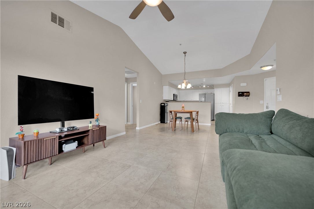 8777 W Maule Avenue, #2109, Las Vegas, NV 89148 Clean tile flooring and high vaulted ceilings flow seamlessly through this open layout.