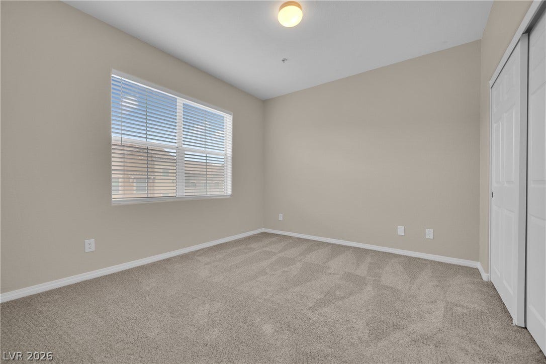8777 W Maule Avenue, #2109, Las Vegas, NV 89148 Plush carpeting and a large window create a comfortable and welcoming atmosphere.