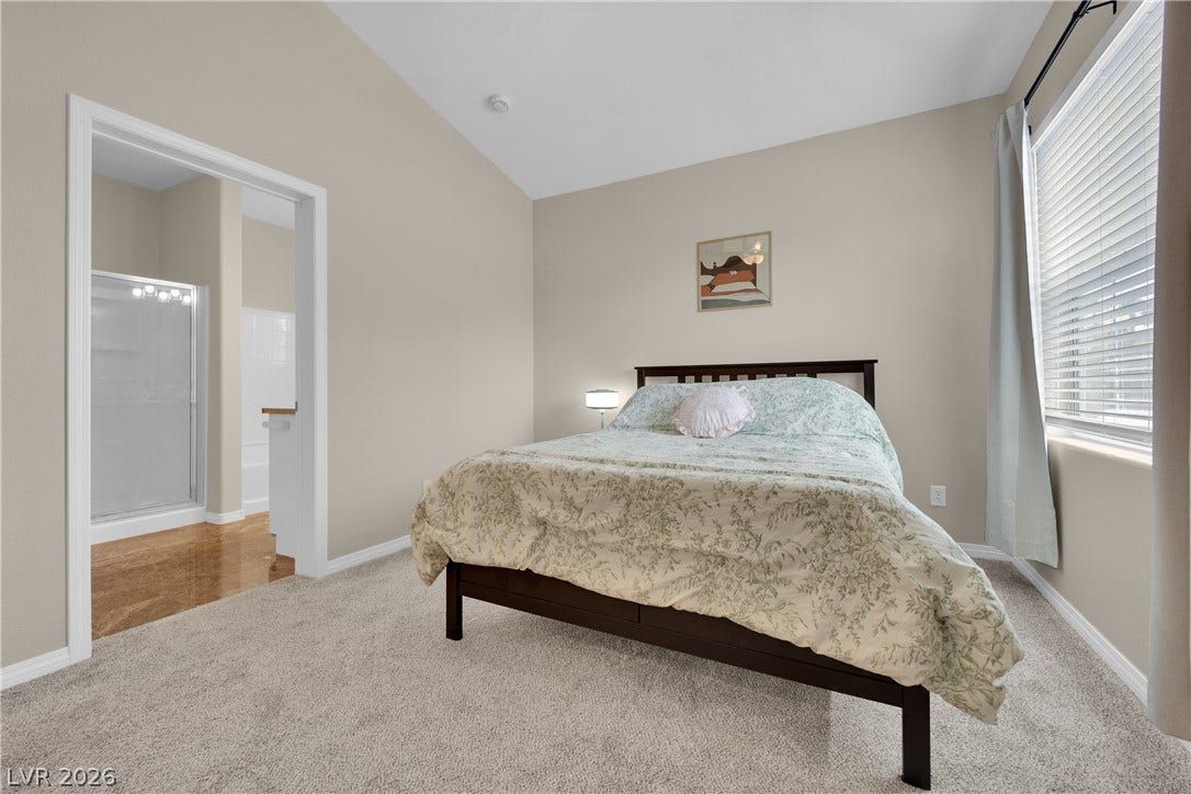8777 W Maule Avenue, #2109, Las Vegas, NV 89148 High vaulted ceilings and soft carpeting define this comfortable bedroom suite with attached bath.