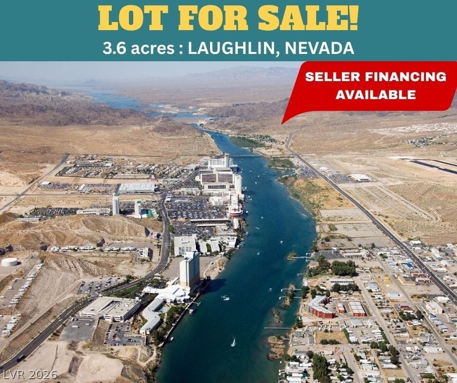 3220 Casino Dr, Laughlin, NV 89029 An expansive aerial vista showcases the surrounding desert terrain and winding river waterway.