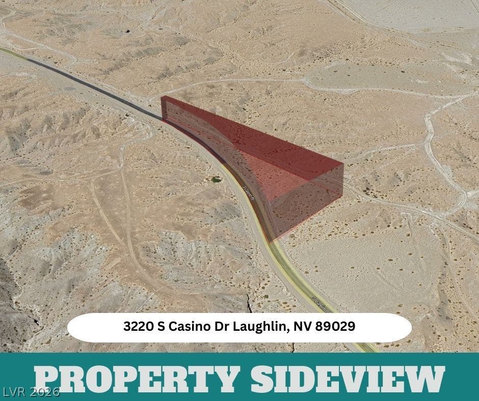 3220 Casino Dr, Laughlin, NV 89029 An aerial view highlights the expansive desert terrain and generous acreage of this property.