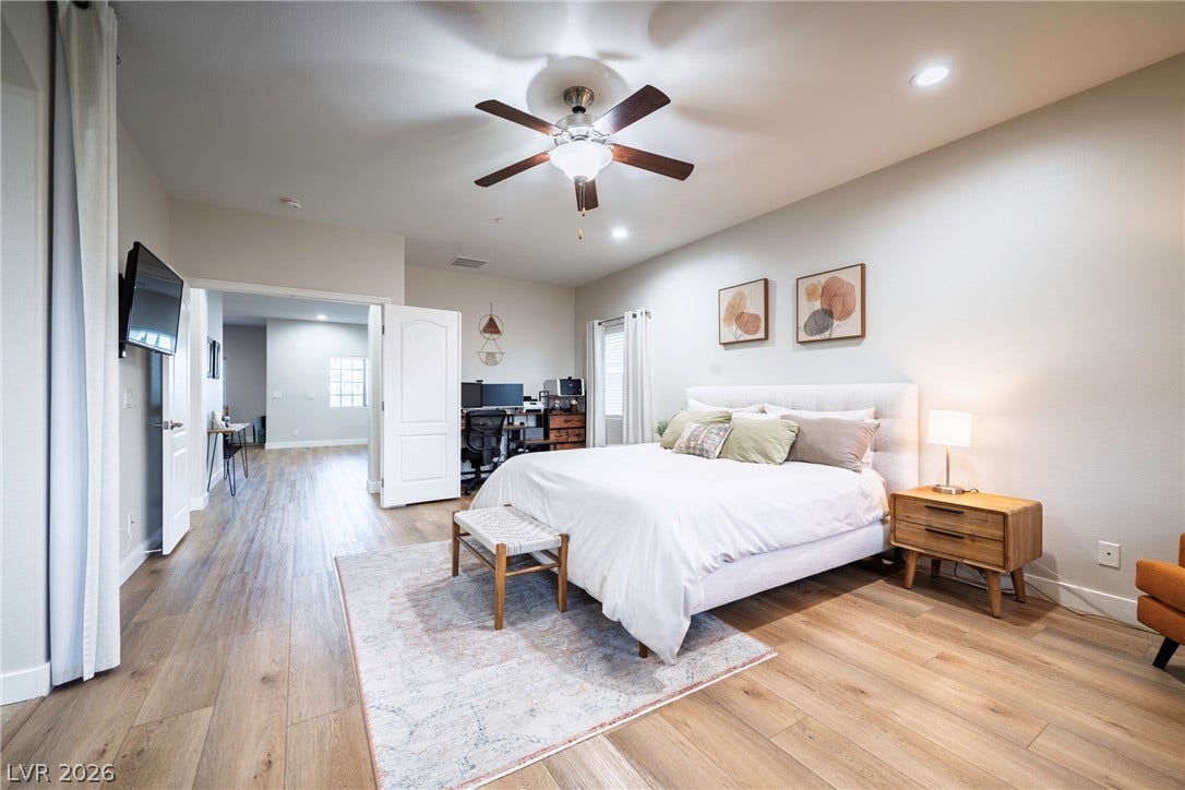 152 Dunblane Street, Henderson, NV 89012 Warm wood flooring and recessed lighting define this comfortable master suite with an open feel.