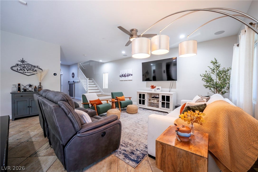 152 Dunblane Street, Henderson, NV 89012 An inviting open-concept living area features a bright stairwell and tile flooring throughout.