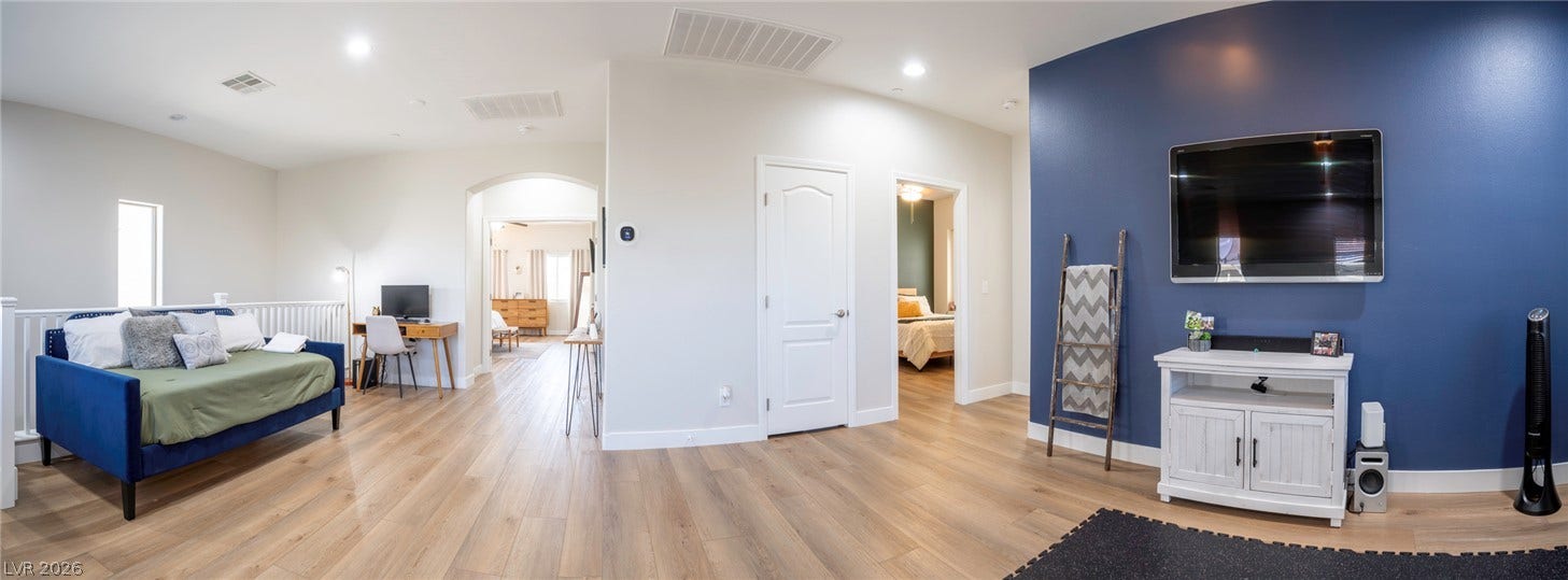 152 Dunblane Street, Henderson, NV 89012 Gleaming hardwood floors and recessed lighting enhance this versatile upstairs landing and loft space.
