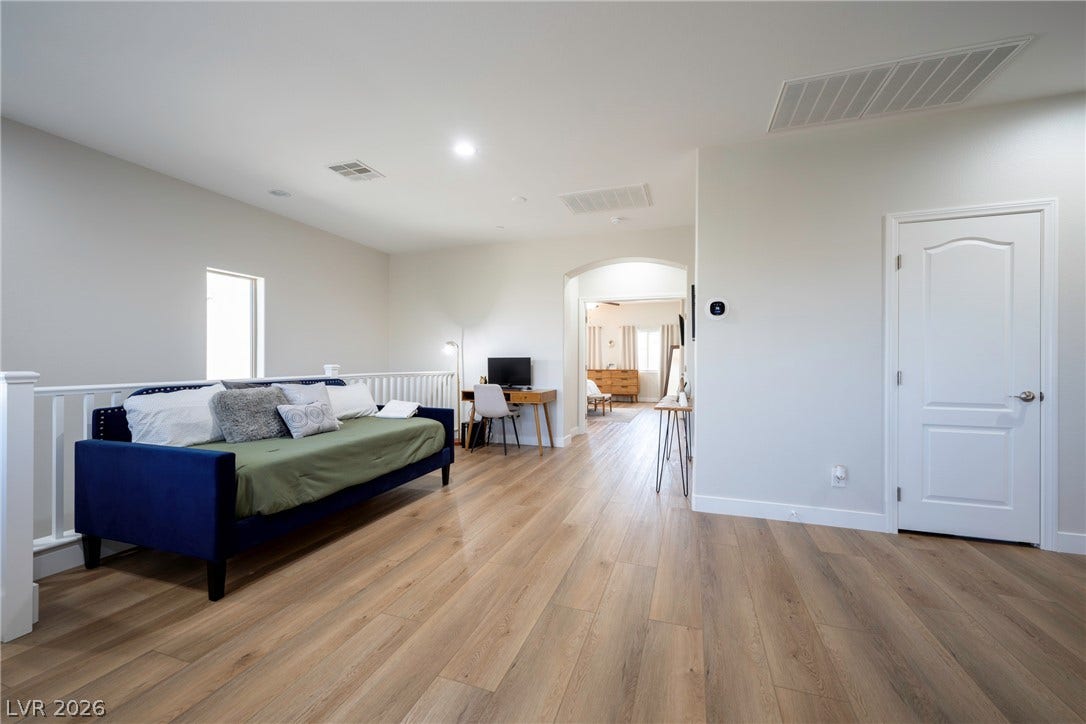 152 Dunblane Street, Henderson, NV 89012 A versatile upper-level loft features warm wood flooring and an open layout.