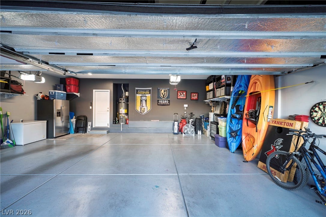 152 Dunblane Street, Henderson, NV 89012 Smooth concrete flooring and built-in alcoves highlight this functional and spacious three-car garage.