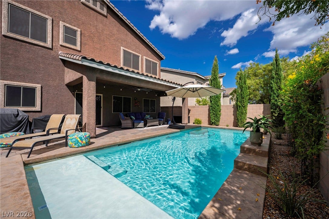 152 Dunblane Street, Henderson, NV 89012 A sparkling swimming pool highlights this backyard oasis adjacent to a sheltered patio space.