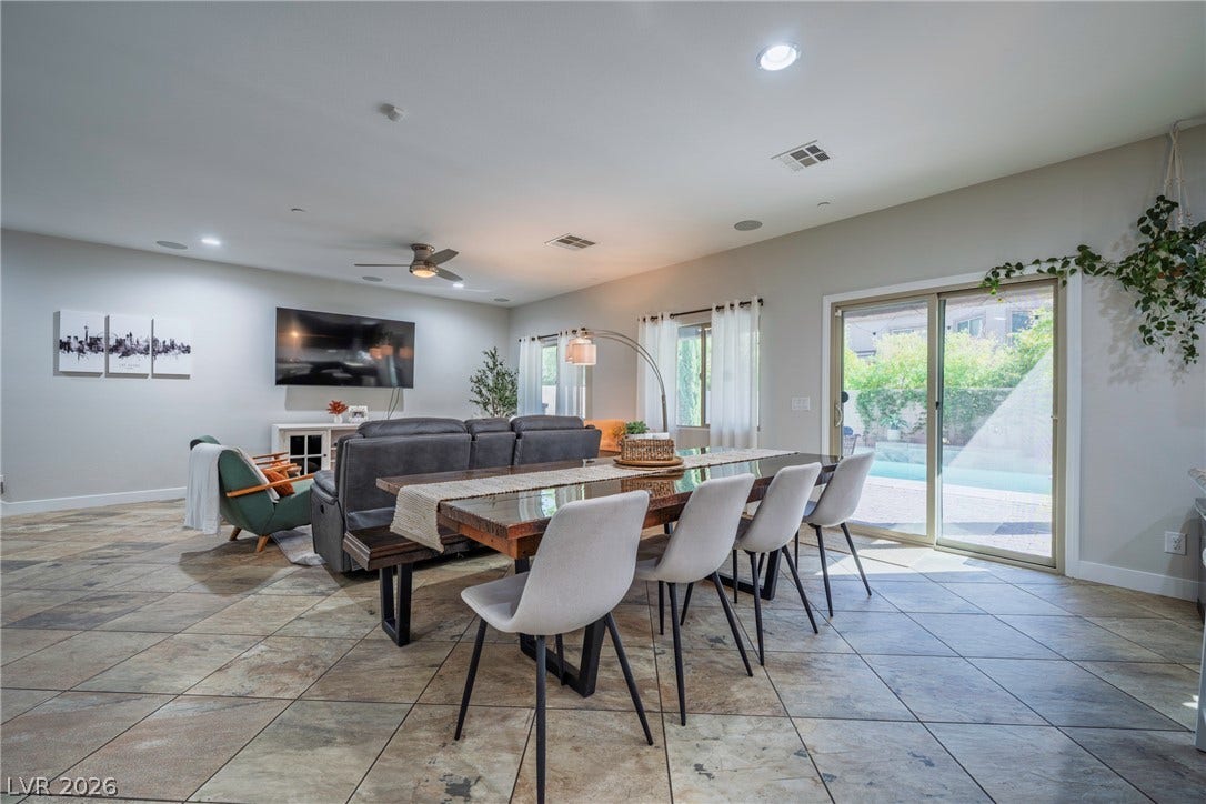 152 Dunblane Street, Henderson, NV 89012 Gleaming tile floors and sliding glass doors define this open dining and living space.