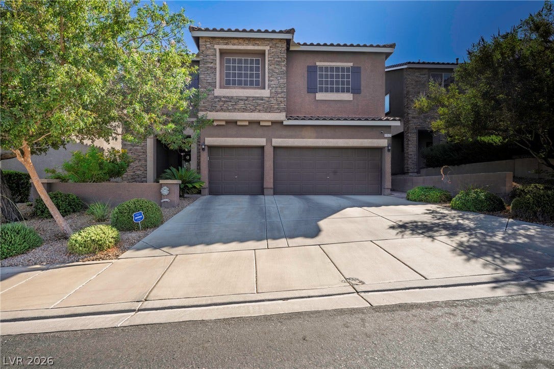 152 Dunblane Street, Henderson, NV 89012 Stone accents and a tile roof define the facade of this two-story residence.