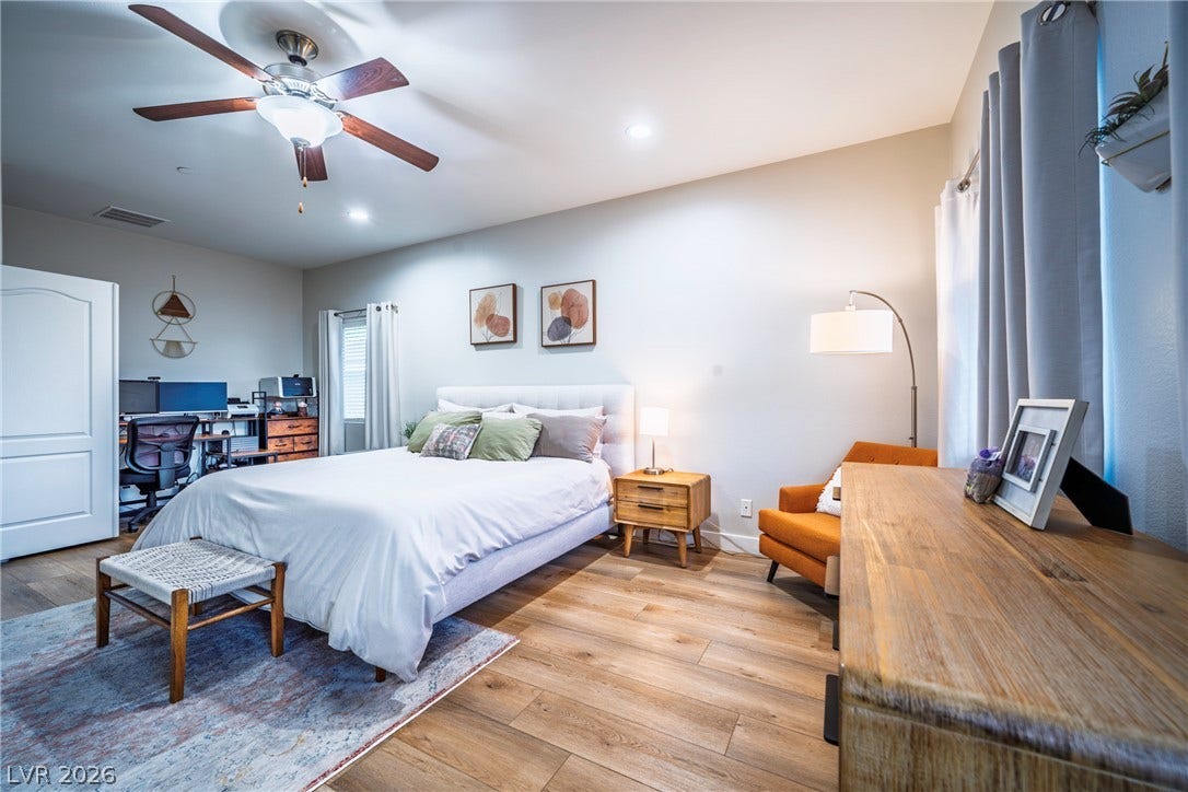 152 Dunblane Street, Henderson, NV 89012 Smooth wood-look flooring and recessed lighting define this comfortable bedroom retreat.