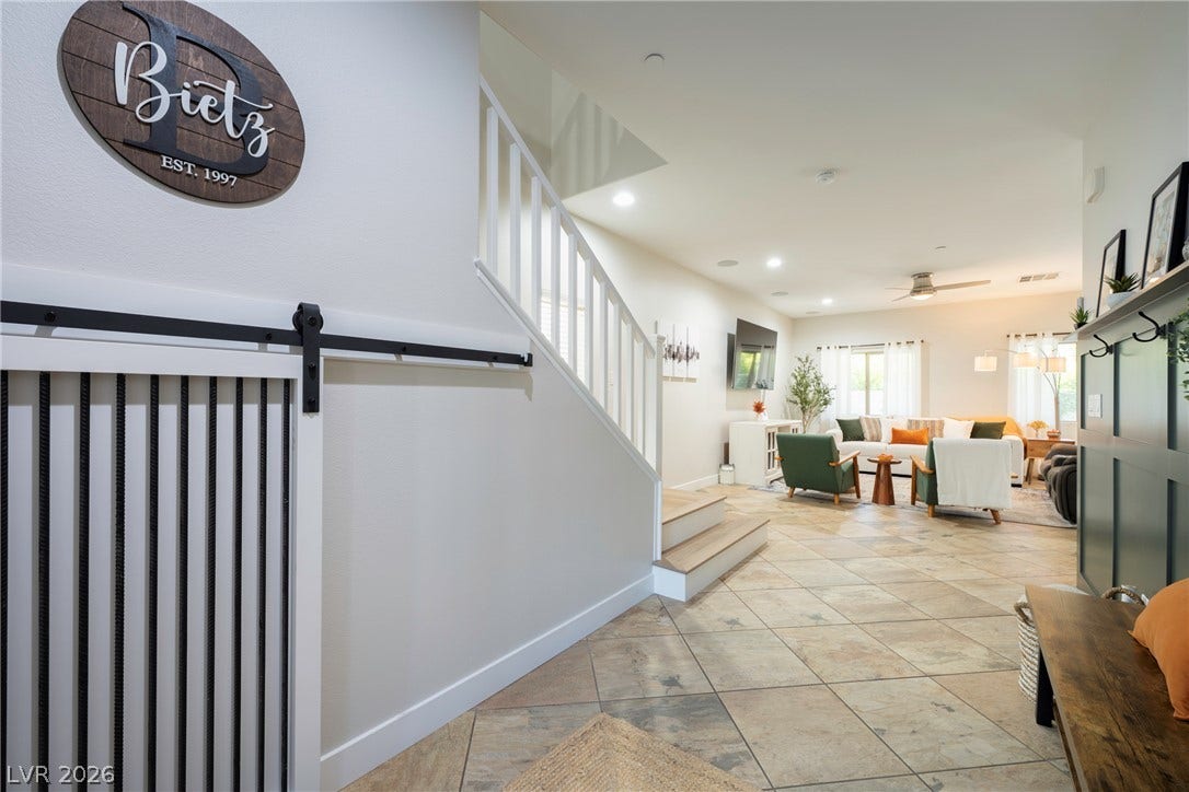 152 Dunblane Street, Henderson, NV 89012 An inviting entry foyer flows seamlessly into a spacious living area featuring tiled floors.