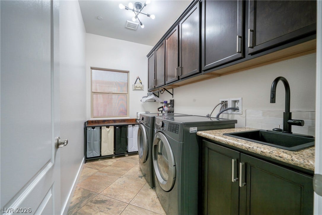 152 Dunblane Street, Henderson, NV 89012 Rich cabinetry and durable tile flooring highlight this functional workspace.