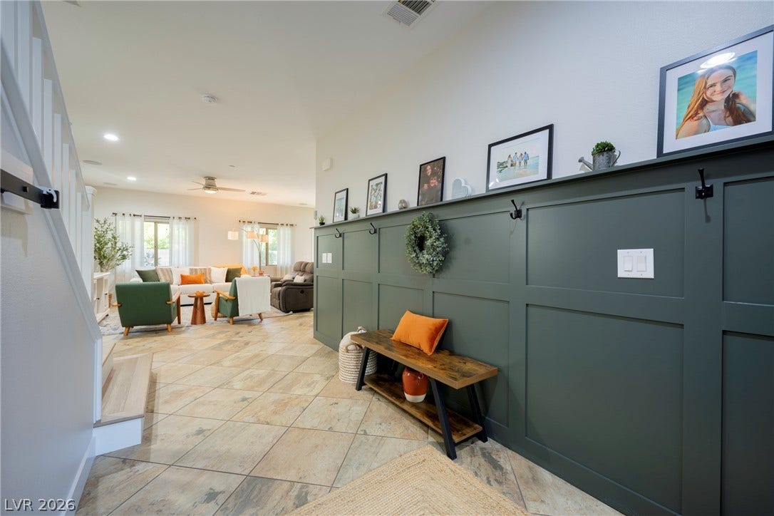 152 Dunblane Street, Henderson, NV 89012 A welcoming entryway with detailed wainscoting leads into an open-concept living area.