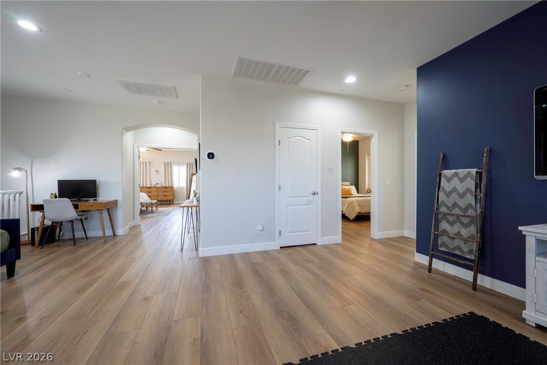 152 Dunblane Street, Henderson, NV 89012 Smooth wood-look flooring and recessed lighting define this versatile second-story common area.