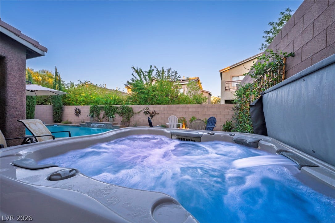 152 Dunblane Street, Henderson, NV 89012 A private hot tub offers a relaxing retreat adjacent to the backyard swimming pool.