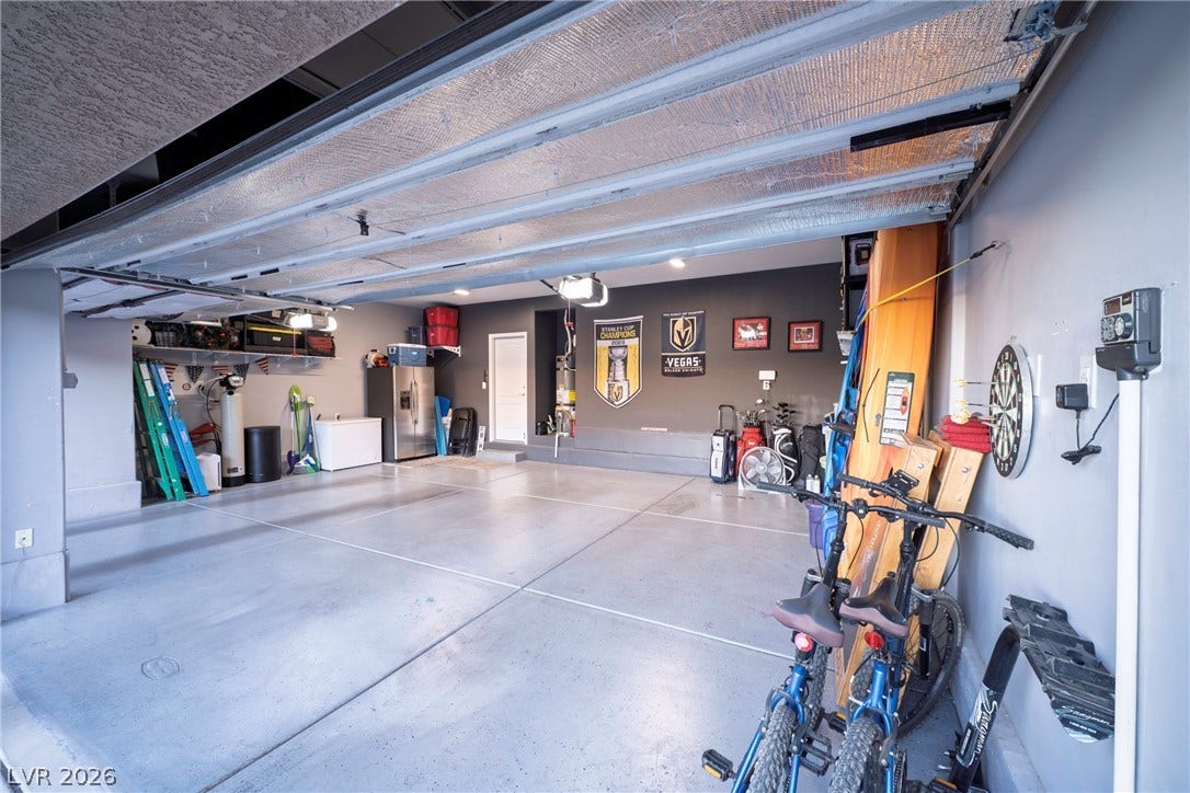 152 Dunblane Street, Henderson, NV 89012 A spacious multi-car garage provides extensive built-in concrete flooring and recess lighting.
