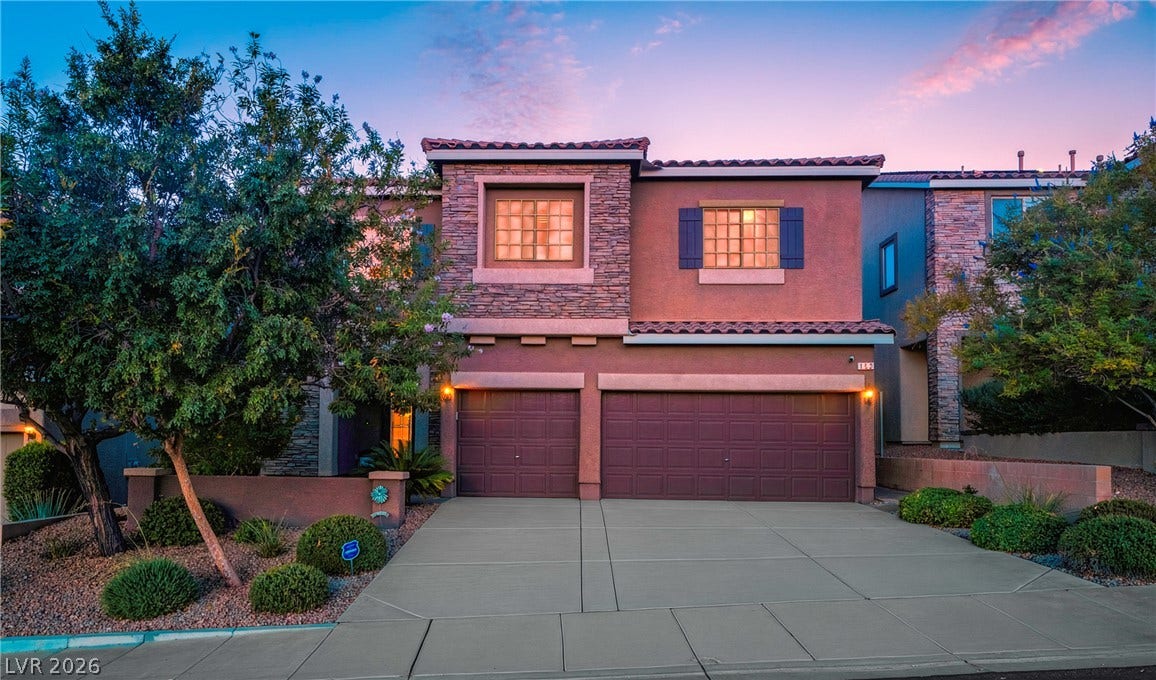 152 Dunblane Street, Henderson, NV 89012 Stone accents and a multi-car garage define this Mediterranean-inspired exterior.