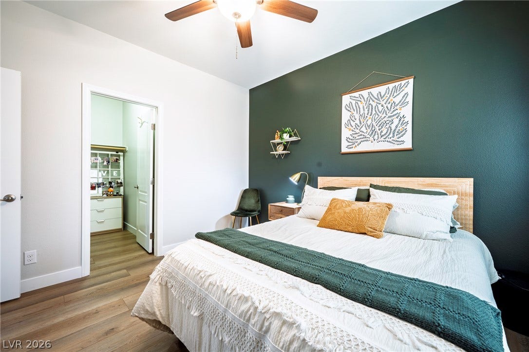 152 Dunblane Street, Henderson, NV 89012 Smooth wood flooring and tall ceilings elevate this comfortable secondary bedroom.