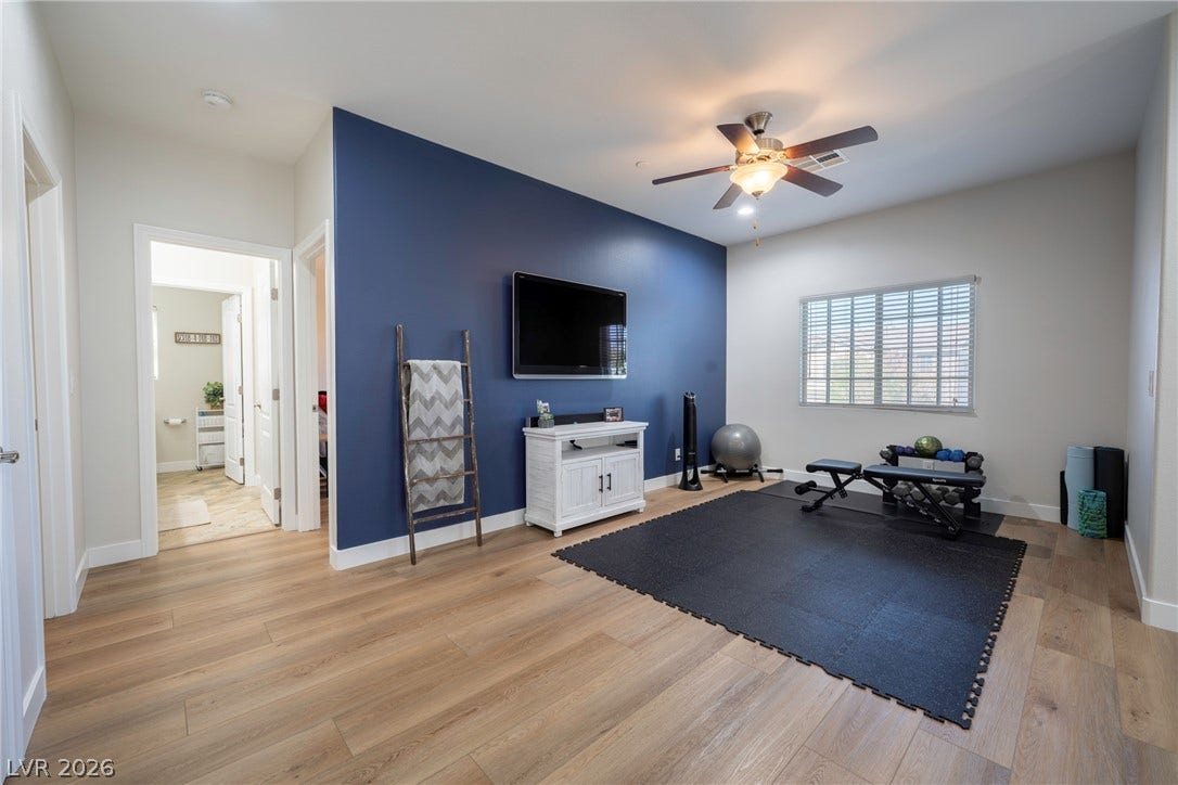 152 Dunblane Street, Henderson, NV 89012 Smooth wood-style flooring runs throughout this versatile space illuminated by natural light.