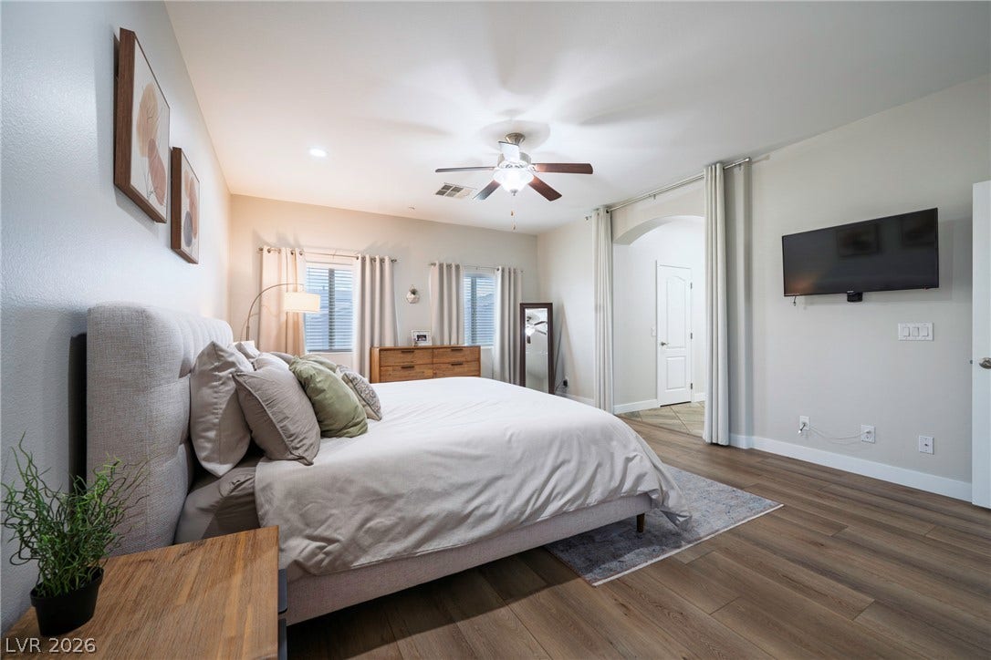 152 Dunblane Street, Henderson, NV 89012 Rich wood-look flooring and an arched doorway elevate this peaceful main-level retreat.