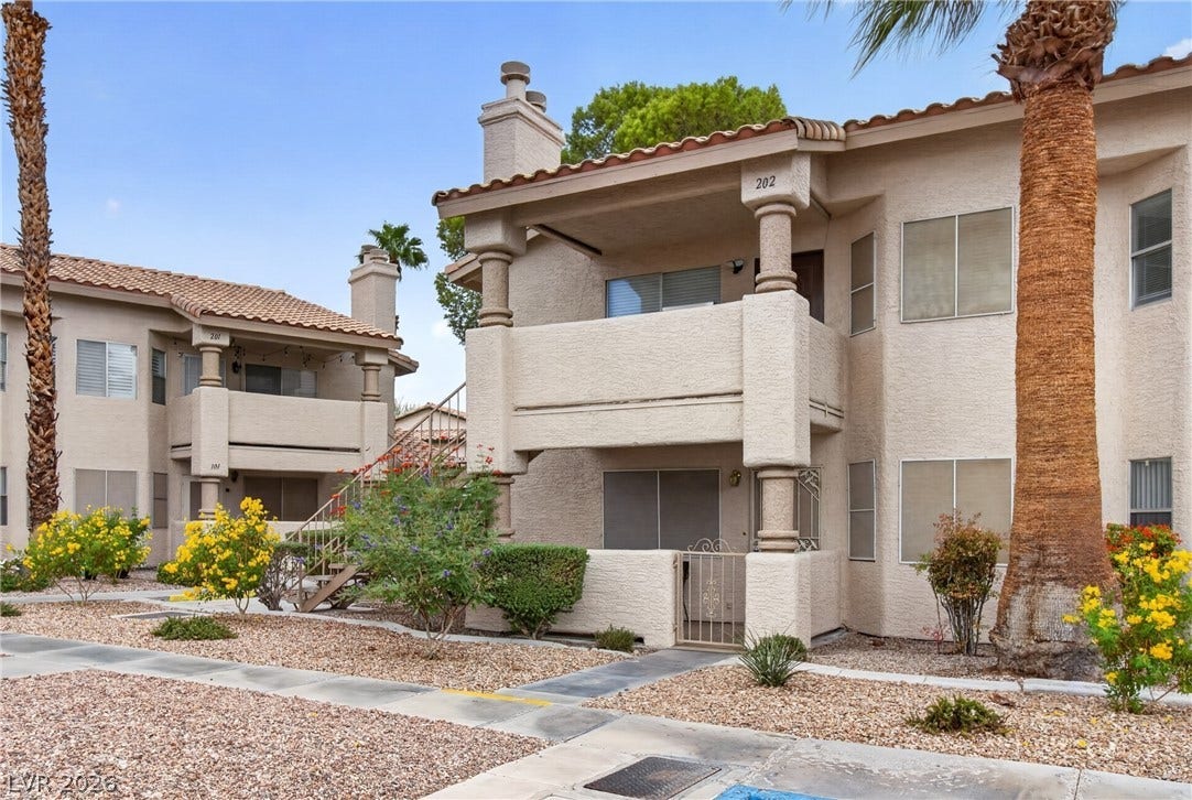 1341 Pinto Rock Lane, #202, Las Vegas, NV 89128 Stucco exteriors paired with classic tile roofing create a timeless southwest aesthetic.