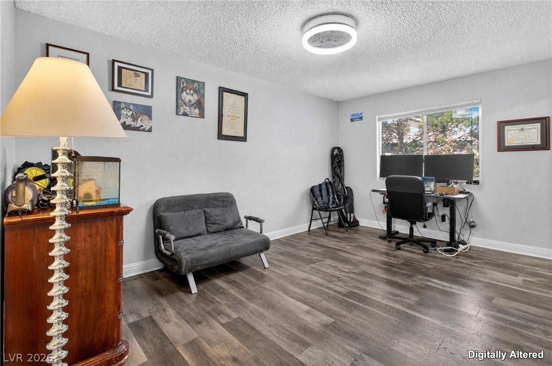 1341 Pinto Rock Lane, #202, Las Vegas, NV 89128 Smooth wood-style flooring runs throughout this versatile room illuminated by a modern overhead fixture.