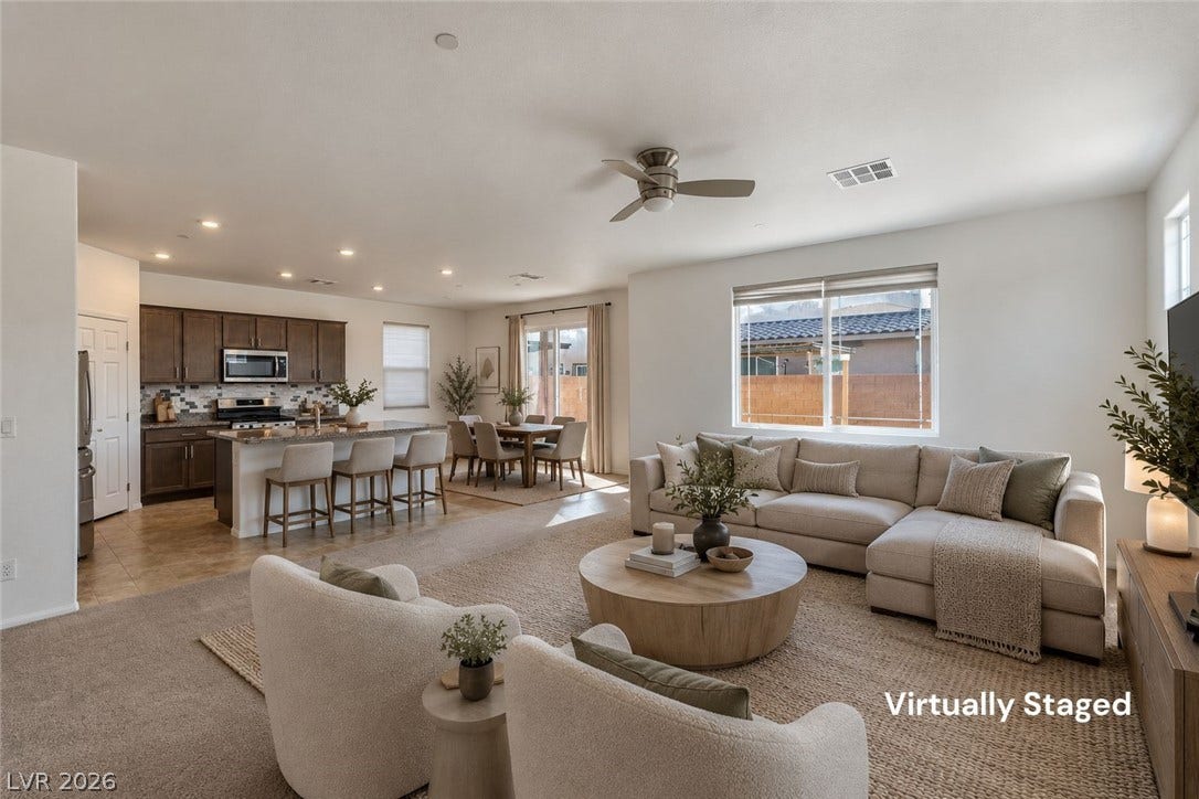 6047 Castle Gardens Avenue, Las Vegas, NV 89130 An open floorplan seamlessly connects the airy living spaces to the adjacent kitchen.