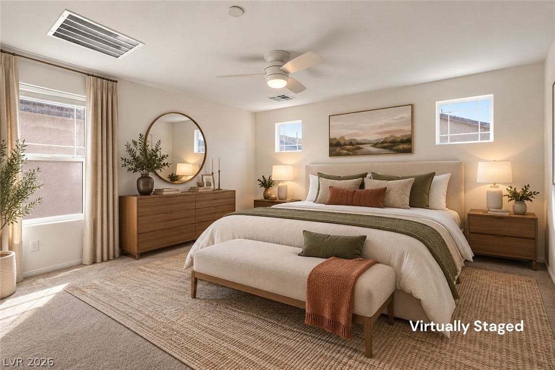 6047 Castle Gardens Avenue, Las Vegas, NV 89130 Plentiful natural light fills this bedroom featuring plush carpeting and clean architectural lines.
