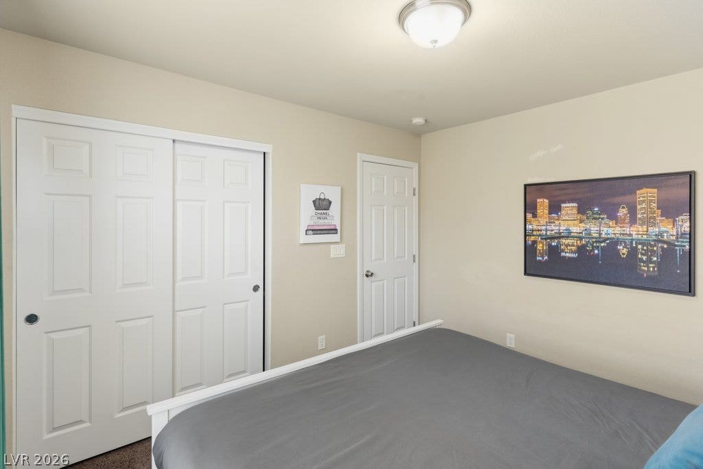 8430 Golden Amber Street, Las Vegas, NV 89139 Six-panel doors and neutral walls define this comfortable bedroom space.