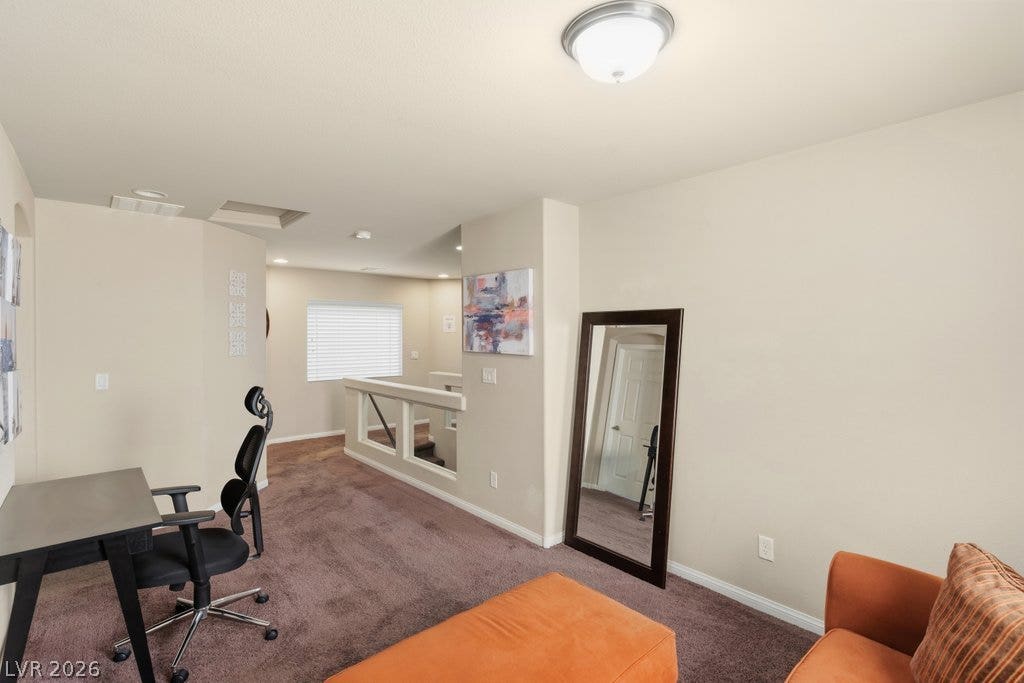 8430 Golden Amber Street, Las Vegas, NV 89139 Plush carpeting and neutrally toned walls define this versatile upper-level loft space.