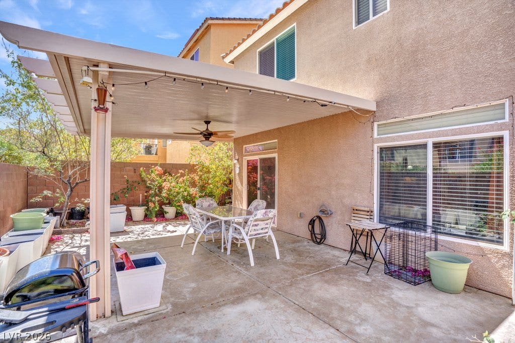 8430 Golden Amber Street, Las Vegas, NV 89139 A spacious concrete patio rests beneath a solid shade cover extending from stucco walls.