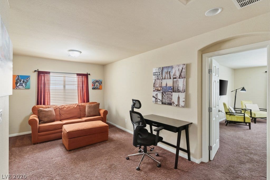 8430 Golden Amber Street, Las Vegas, NV 89139 Plush wall-to-wall carpeting and wide doorways define this versatile secondary living area.