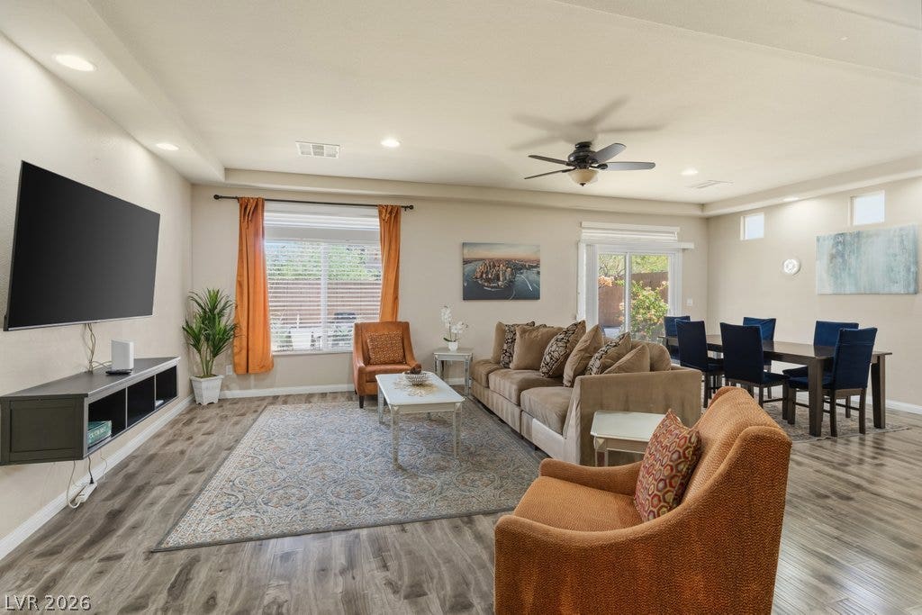 8430 Golden Amber Street, Las Vegas, NV 89139 An open floor plan seamlessly connects the main living spaces over durable wood-look flooring.