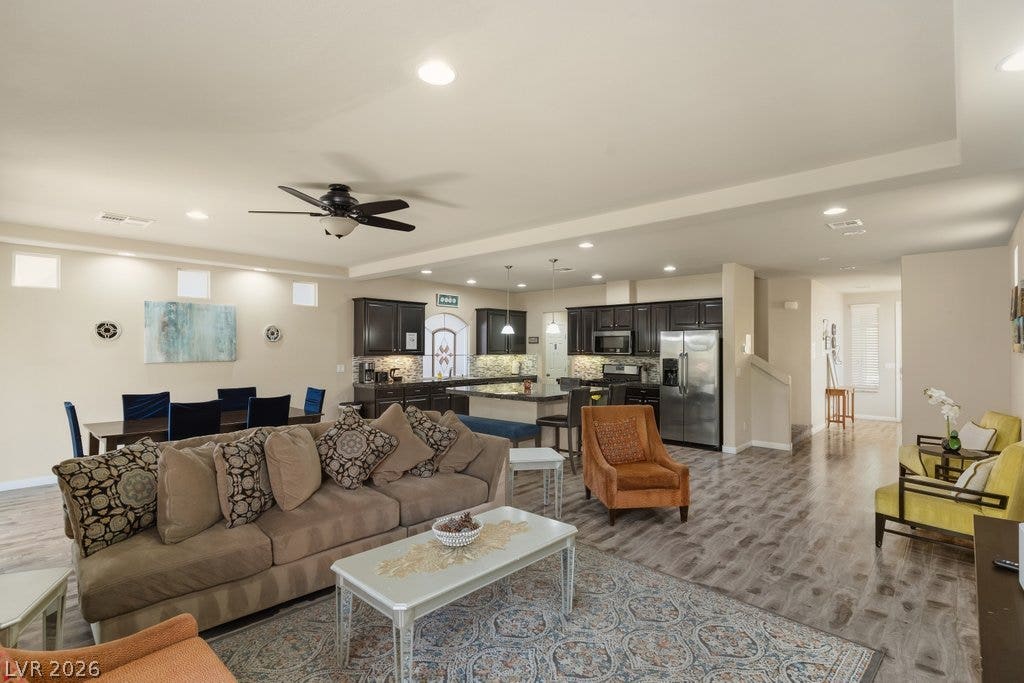 8430 Golden Amber Street, Las Vegas, NV 89139 Polished hard-surface flooring flows through the spacious open layout connecting the main living areas.