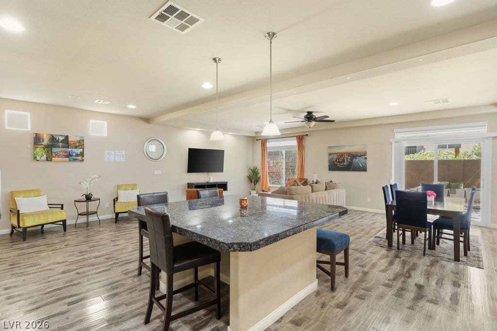 8430 Golden Amber Street, Las Vegas, NV 89139 An expansive open floorplan connects the central kitchen island to the inviting living spaces.