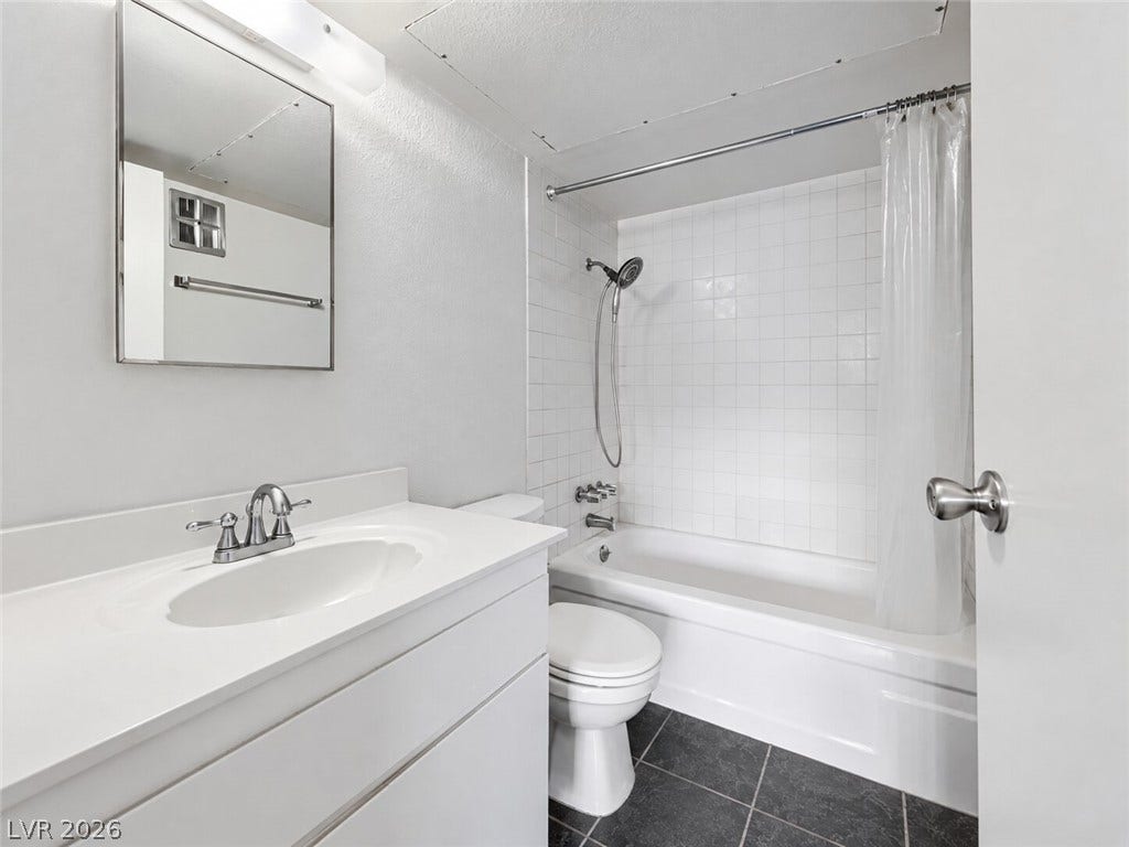 615 S Royal Crest Circle, #16, Las Vegas, NV 89169 Crisp white tiling surrounds the classic bathtub in this clean, updated bathroom.
