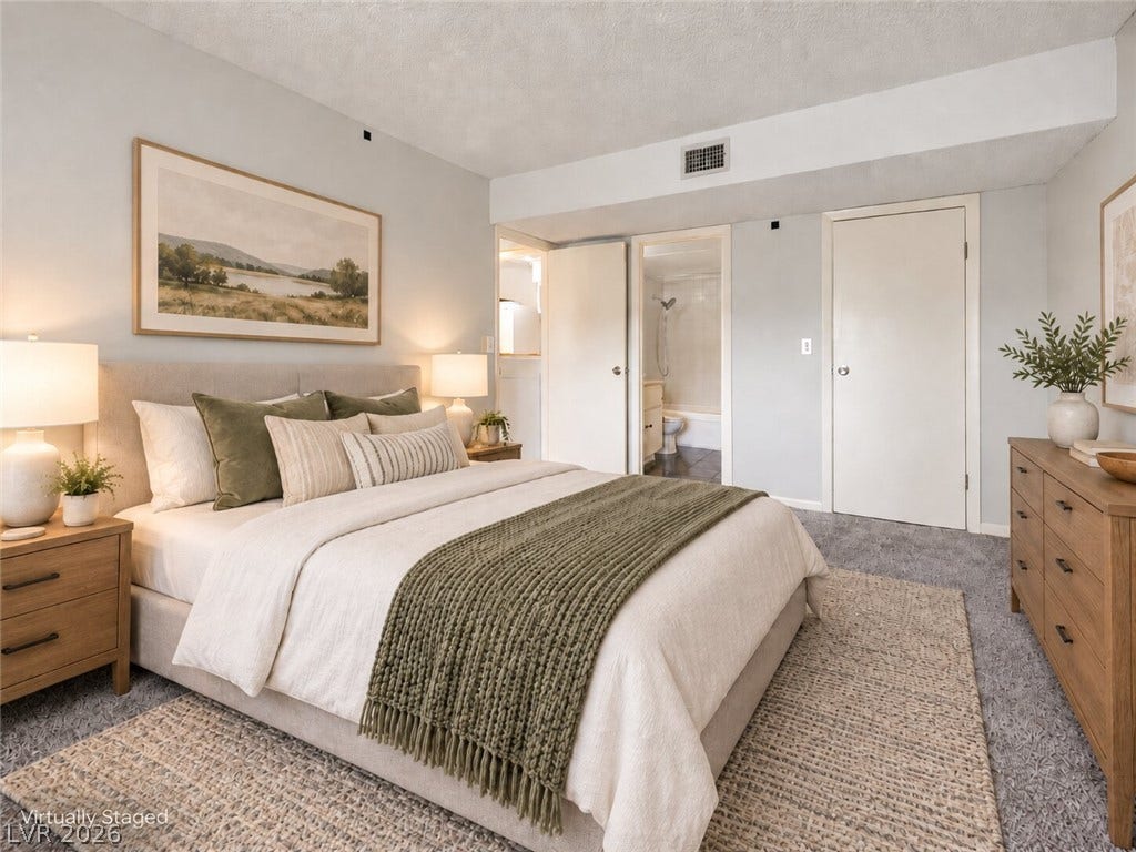 615 S Royal Crest Circle, #16, Las Vegas, NV 89169 Plush wall-to-wall carpeting and neutral tones create a quiet, restful retreat with ensuite bath access.
