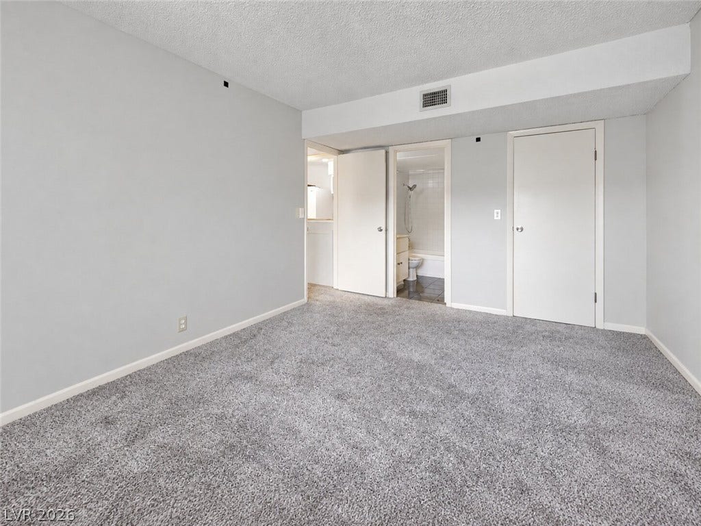 615 S Royal Crest Circle, #16, Las Vegas, NV 89169 Plush wall-to-wall carpeting and clean neutral walls anchor this versatile bedroom space.