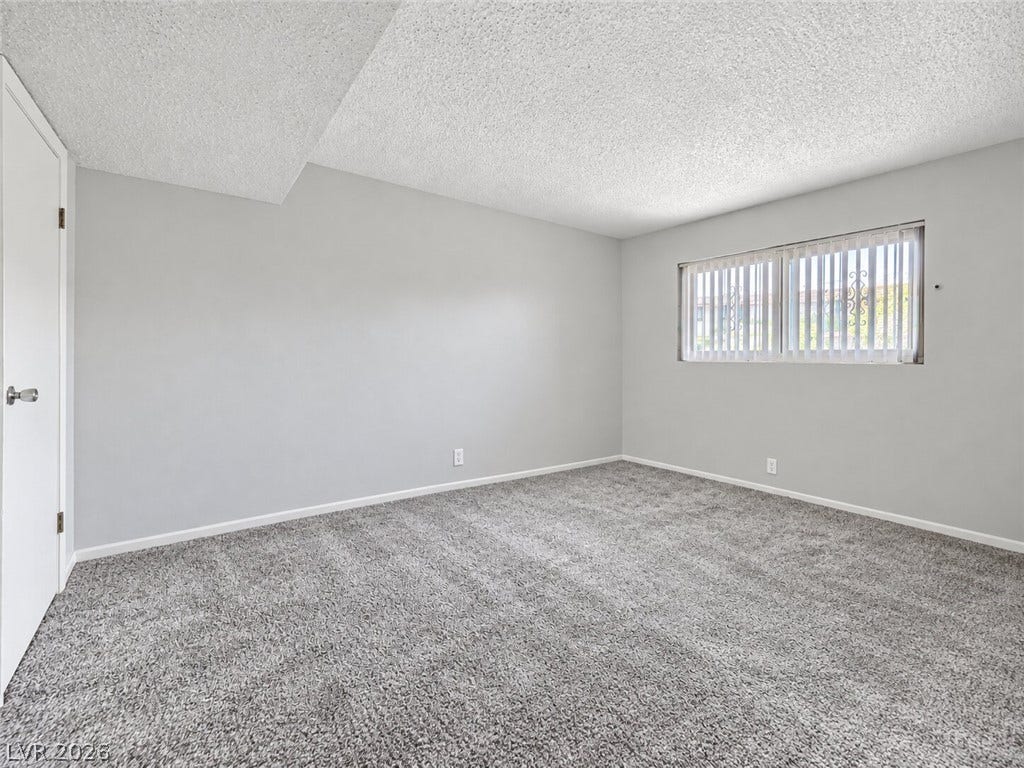 615 S Royal Crest Circle, #16, Las Vegas, NV 89169 Plush wall-to-wall carpeting and neutral walls define this versatile bedroom space.