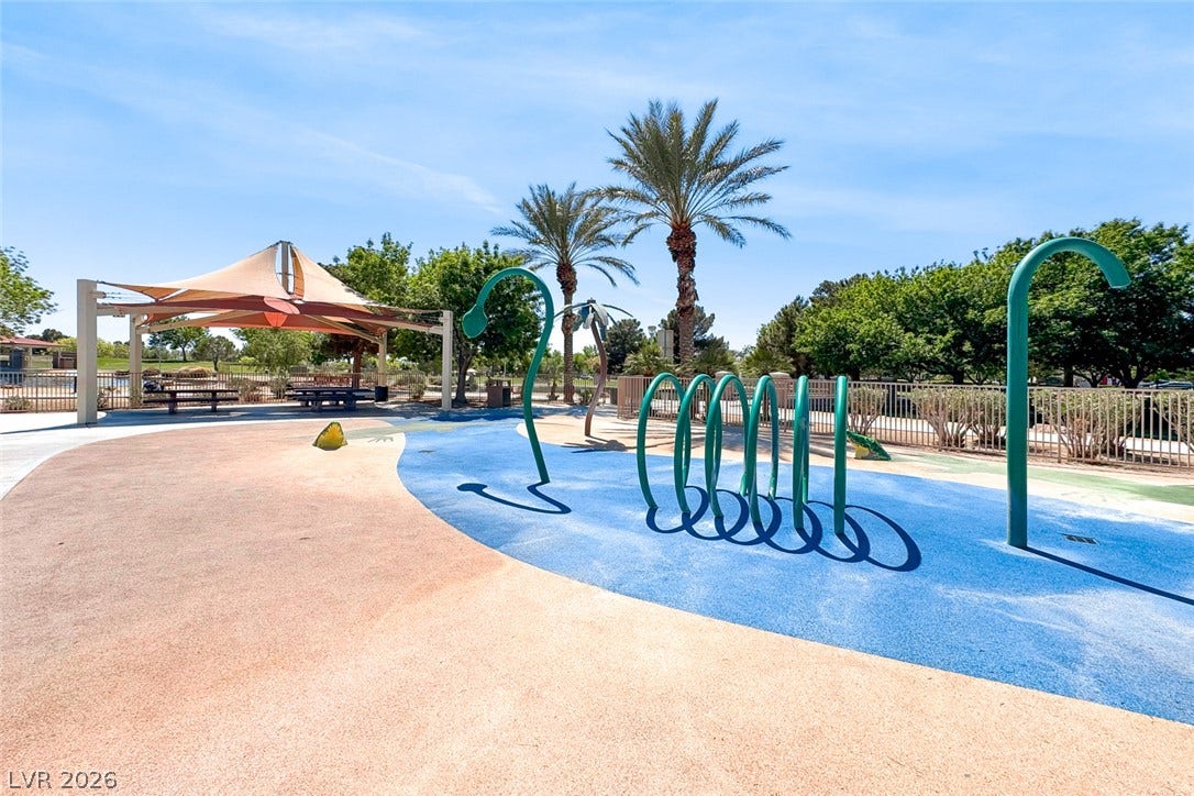 2906 Pumpkin Harvest Avenue, North Las Vegas, NV 89031 A vibrant neighborhood splash pad features playful water structures and a shaded seating pavilion.